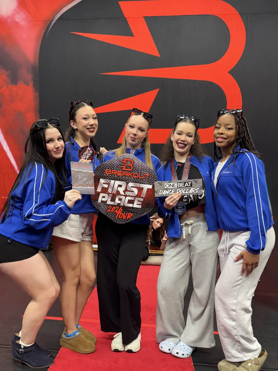Dancers with a first place trophy